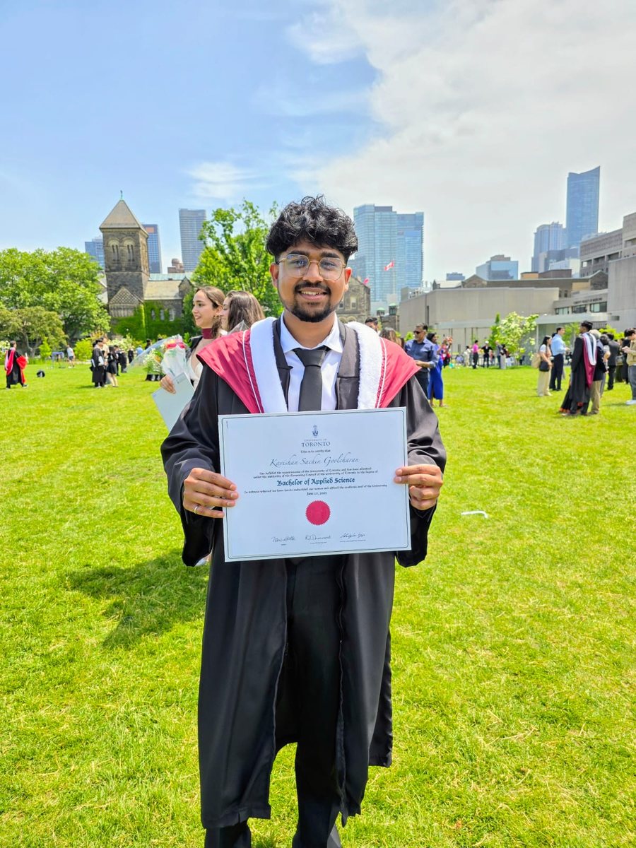 Kavishan Goolcharan holding his B.A.Sc. certificate at University of Toronto convocation